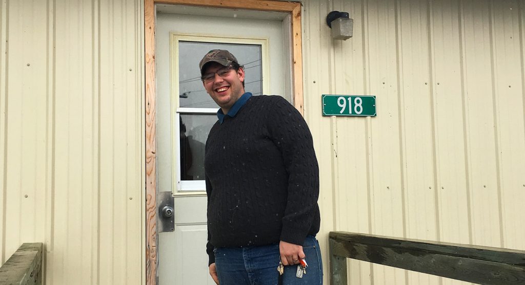 Man in front of door